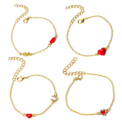 Gouden armbanden set met hartjes en lippen