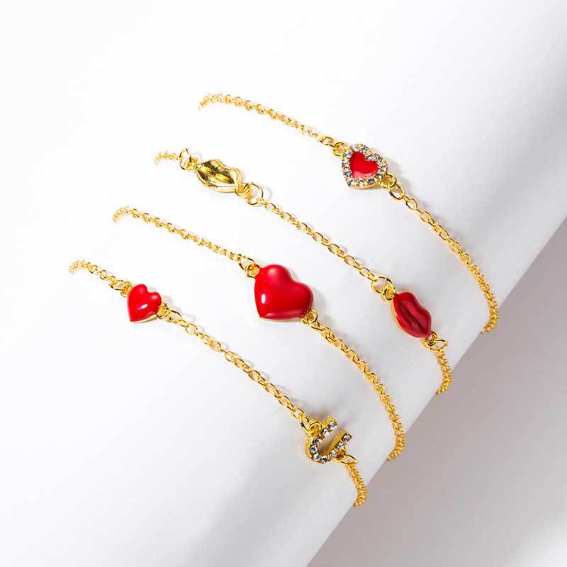 Gouden armbanden set met hartjes en lippen