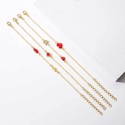 Gouden armbanden set met hartjes en lippen