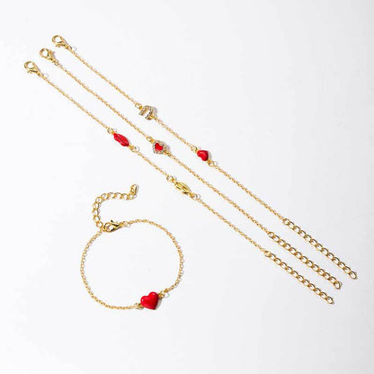 Gouden armbanden set met hartjes en lippen