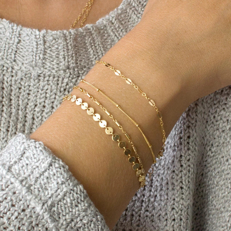 Set van 4 subtiele gouden armbandjes